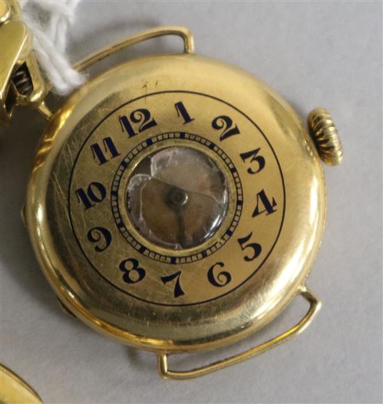 A ladys early 20th century 18ct gold half hunter wrist watch on an 18ct gold flexi-link bracelet,